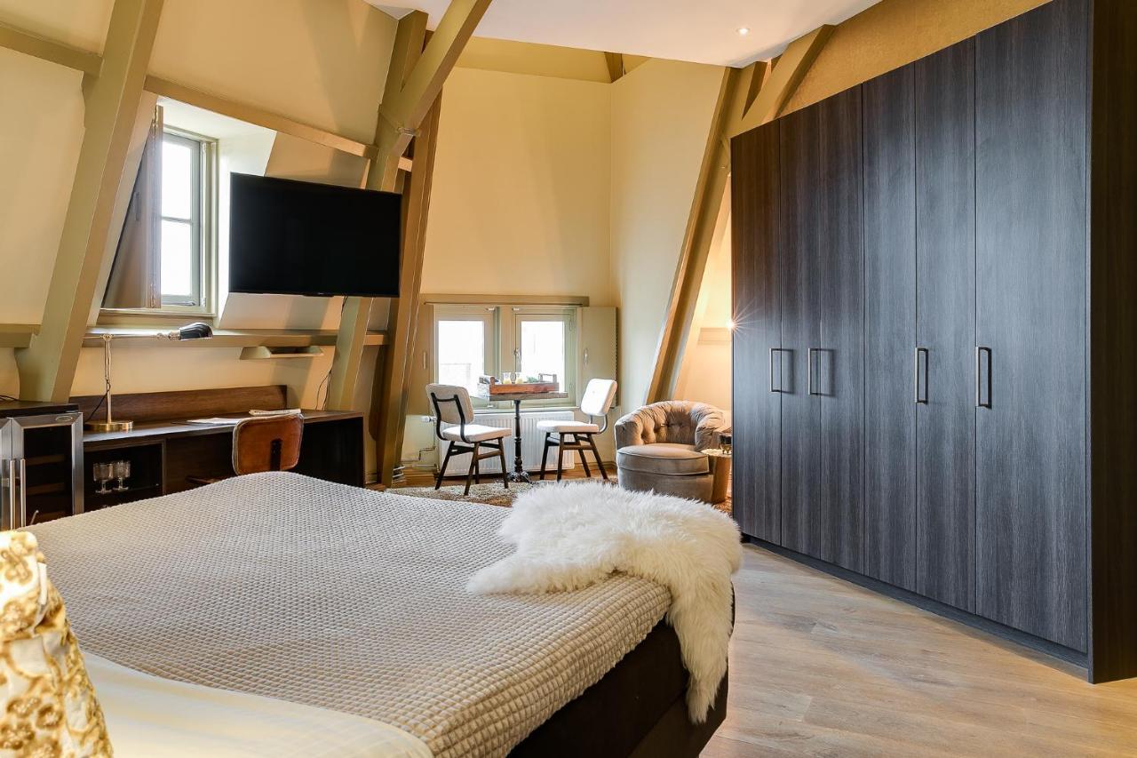 Brasss Hotel Suites Haarlem Exterior foto A bedroom at the hotel