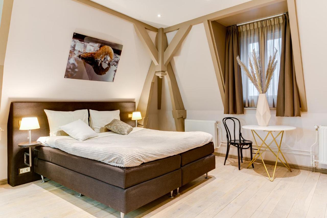 Brasss Hotel Suites Haarlem Exterior foto A room at the hotel
