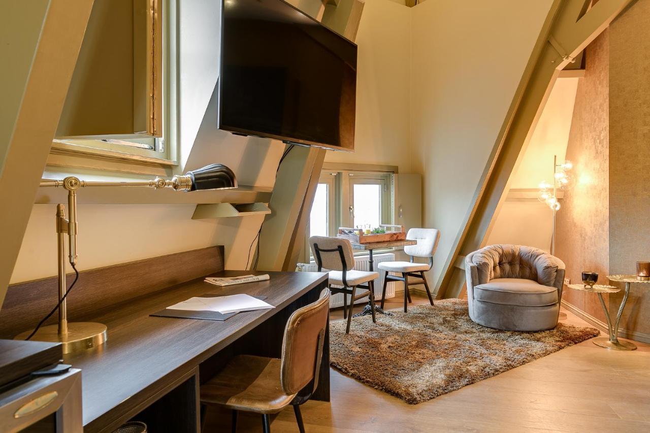 Brasss Hotel Suites Haarlem Exterior foto The interior of a typical apartment